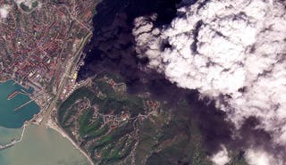 A satellite image of smoke rising after, according to Ukraine's military, an overnight strike on an oil refinery hit reservoir tank storage and started a fire in Tuapse